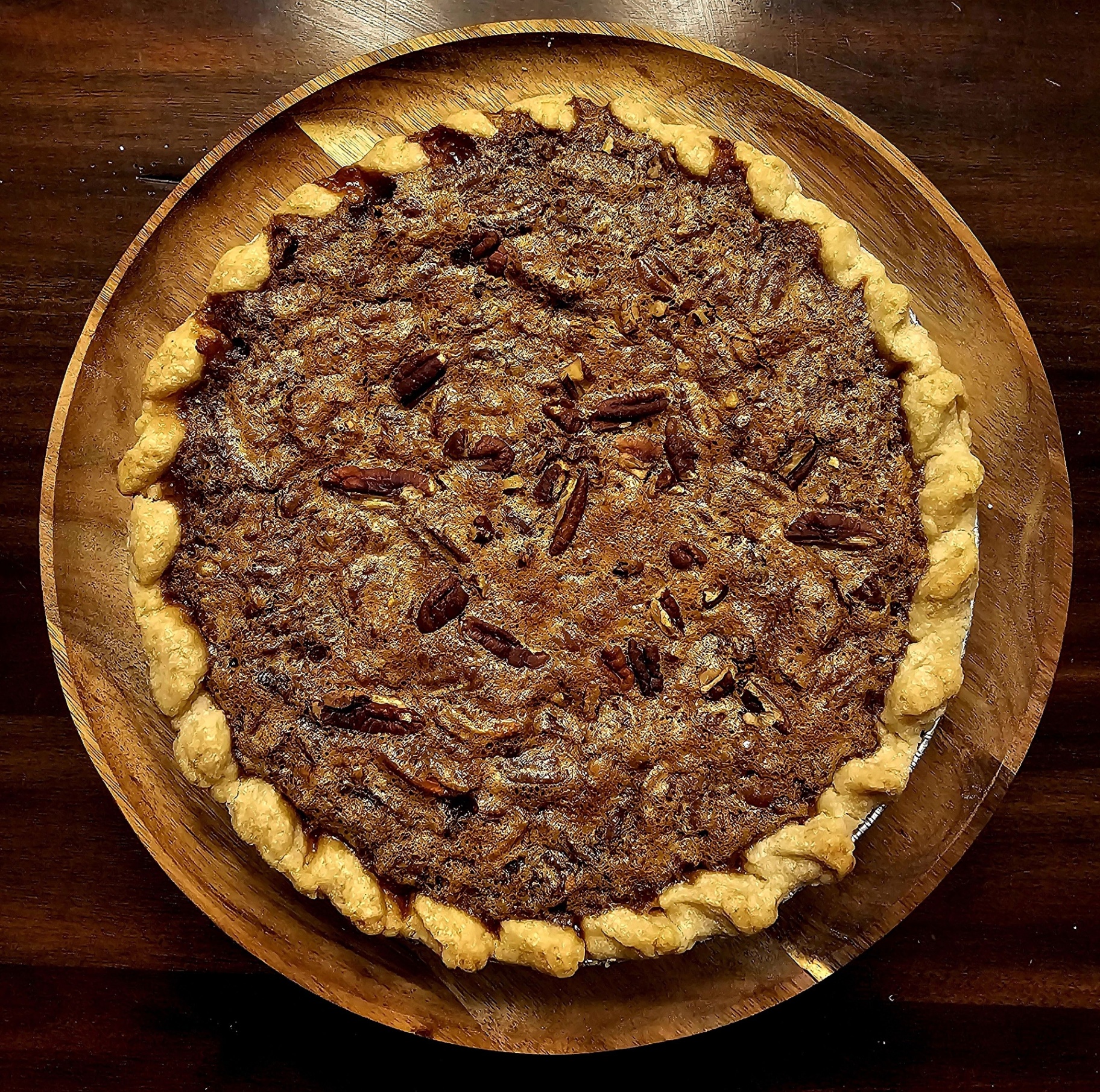 Homemade pecan pie with hand-crimped crust