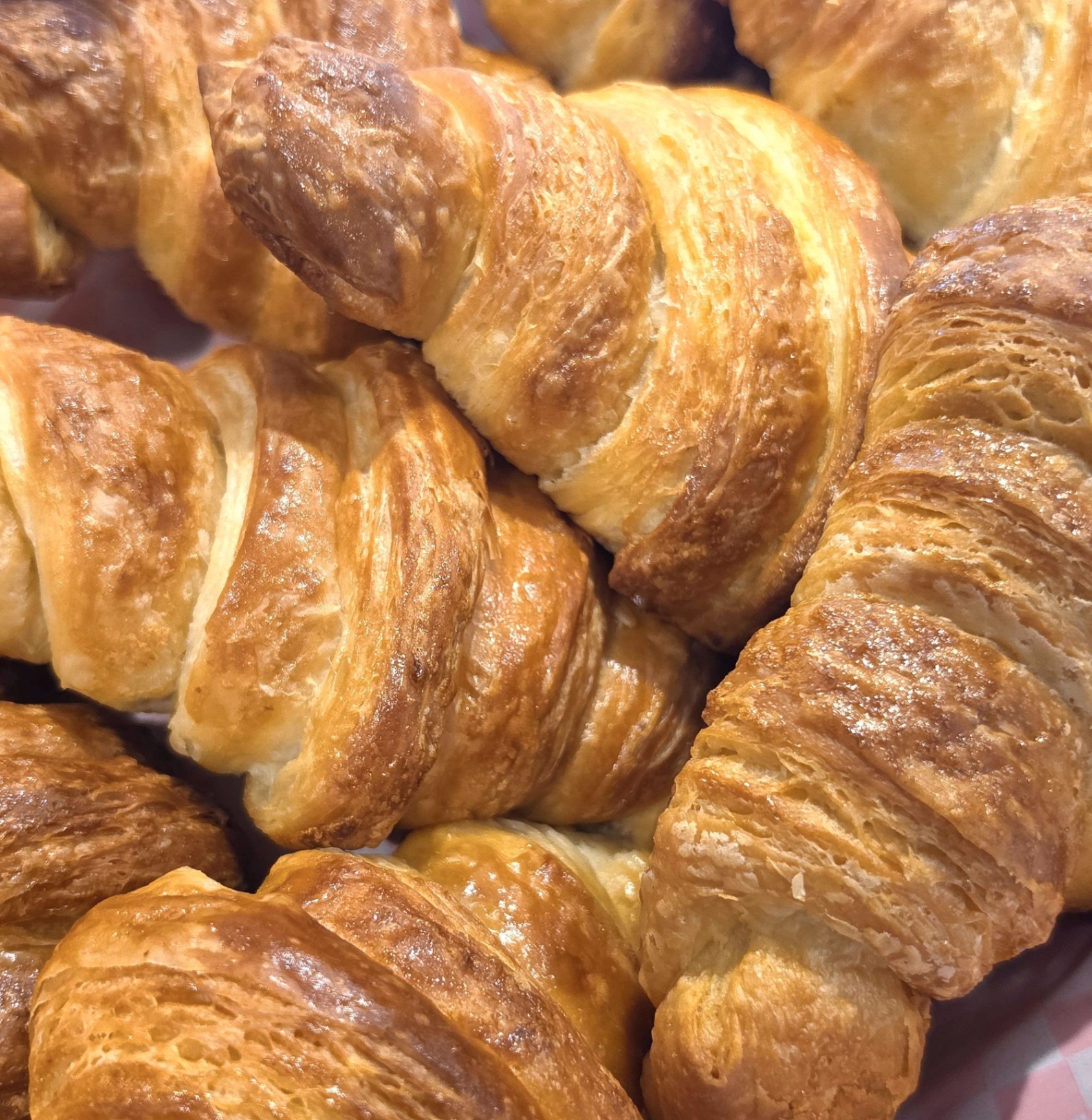 Golden, freshly baked plain croissants