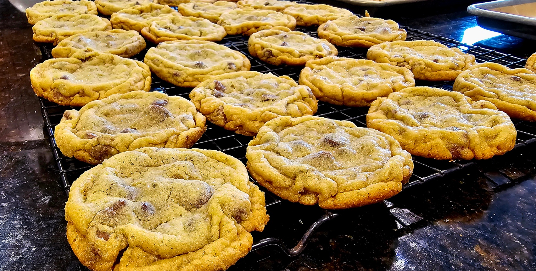 Rack of freshly baked chocolate chip cookies