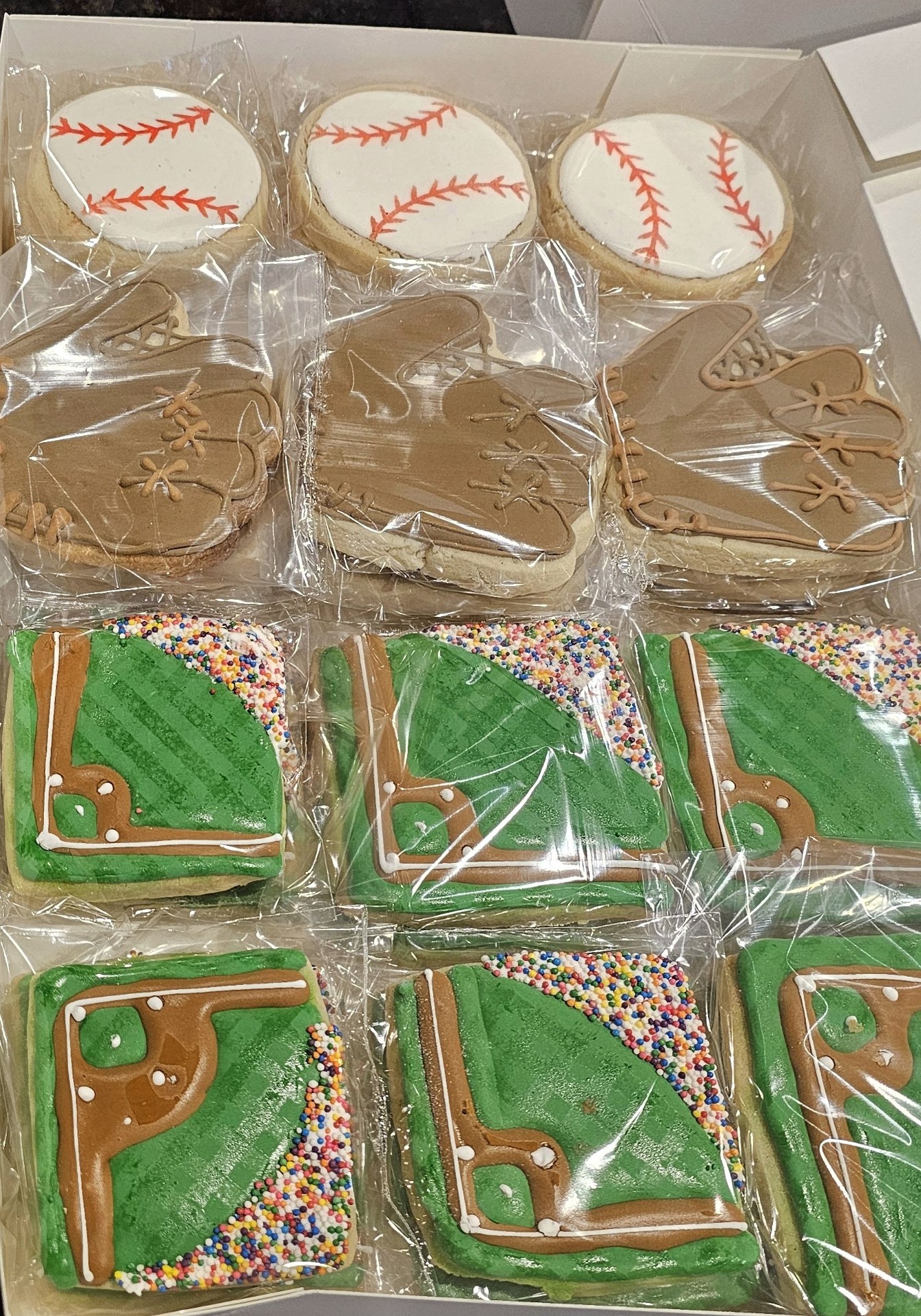 Baseball-themed cookie set with baseballs, gloves, and fields