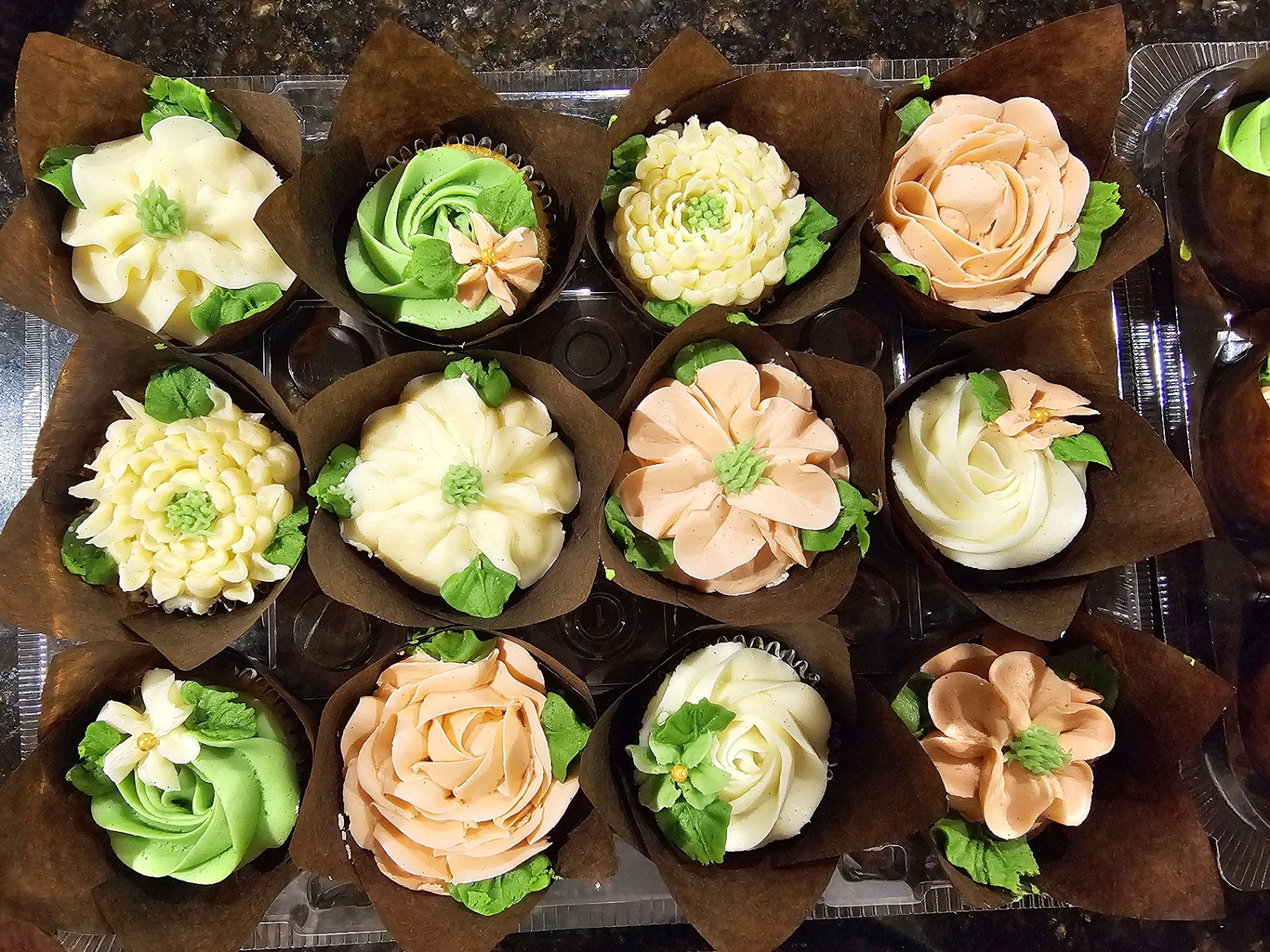 Tray of buttercream floral cupcakes