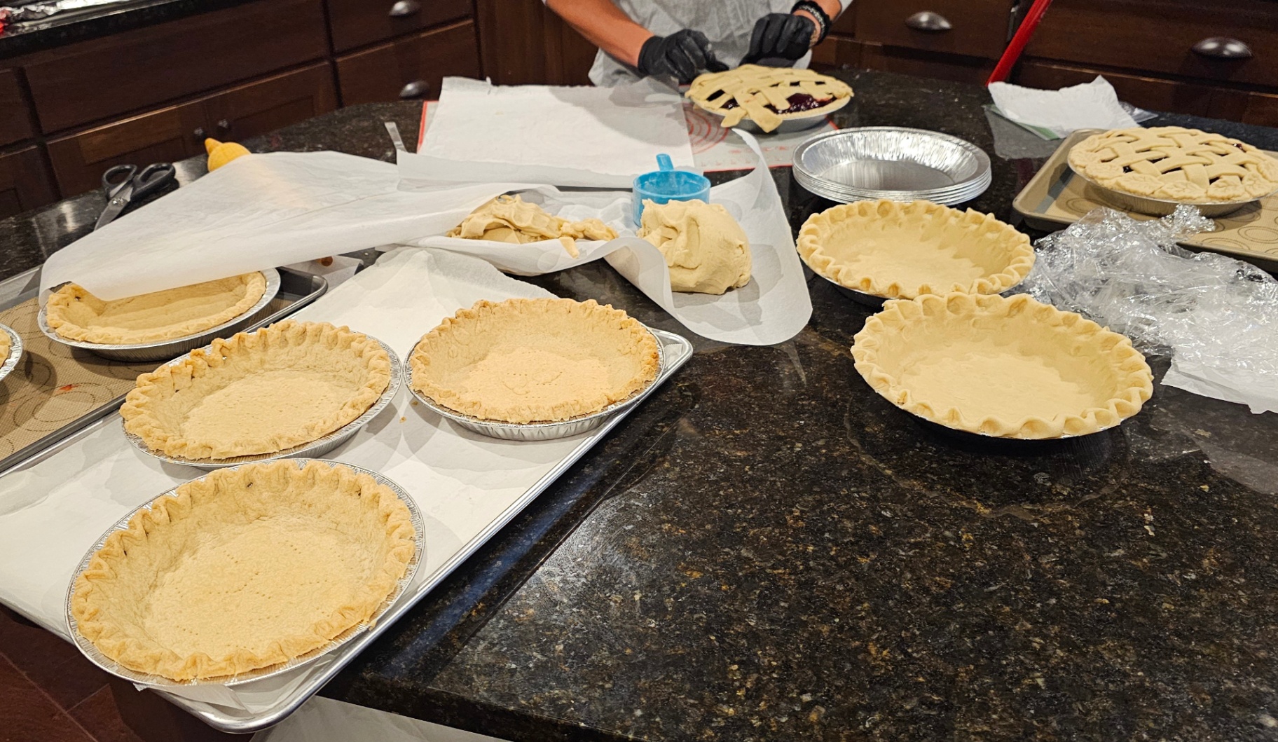 Hand-crimped pie crusts prepped and ready for filling