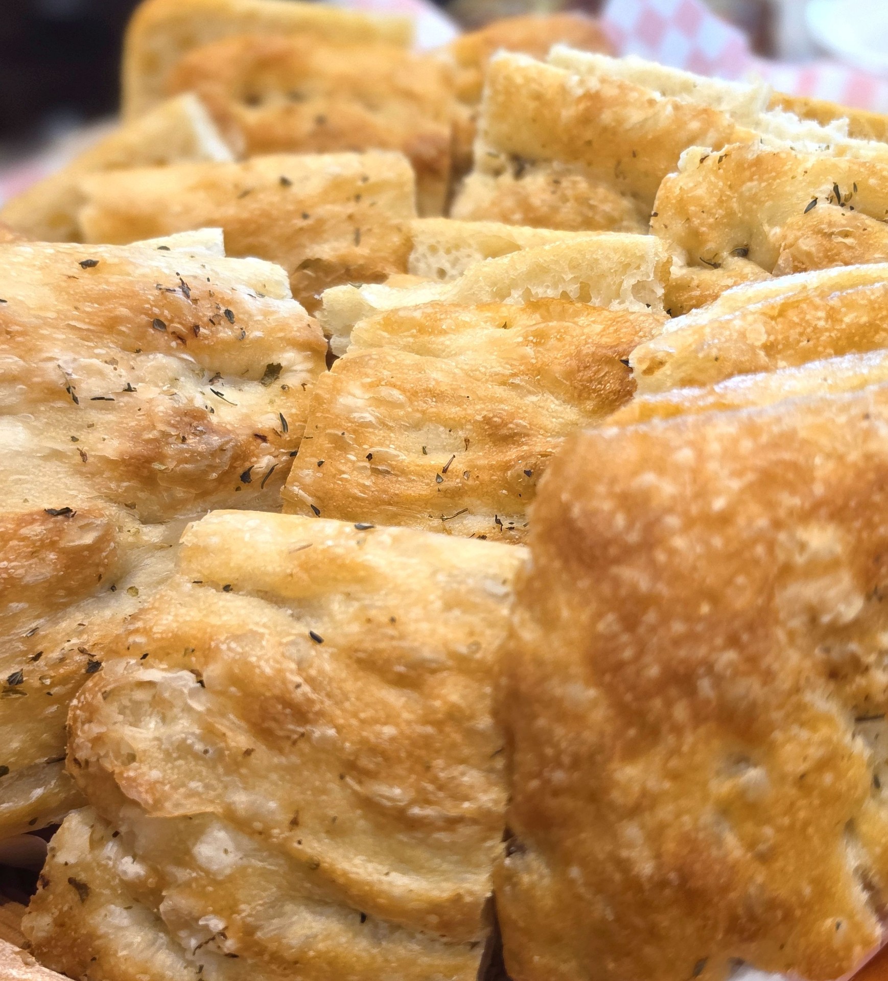 Fresh focaccia with herbs and olive oil
