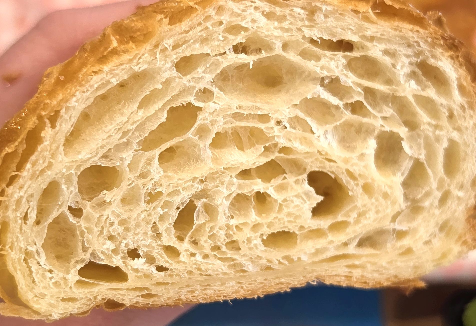 Close-up of croissant interior showing honeycomb crumb