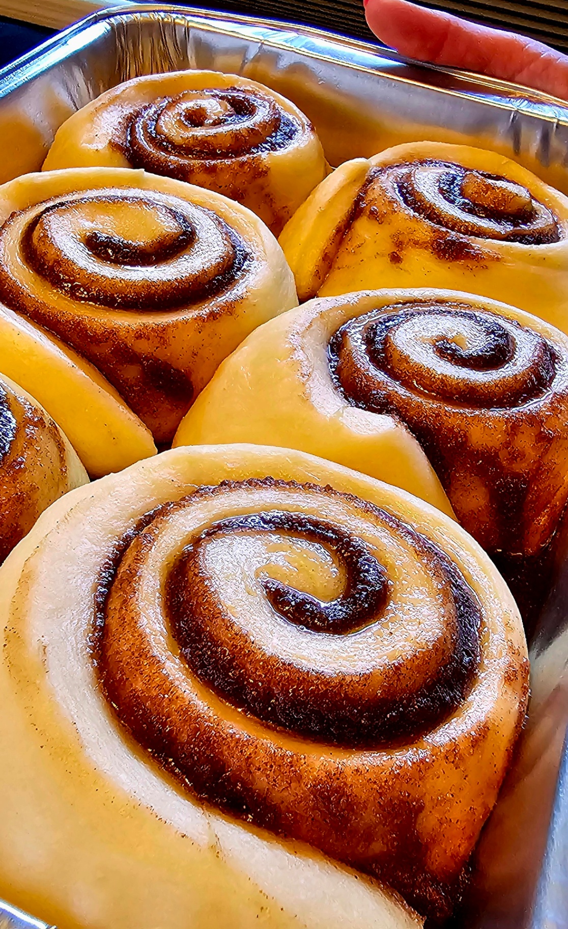 Pan of unfrosted cinnamon rolls fresh from the oven