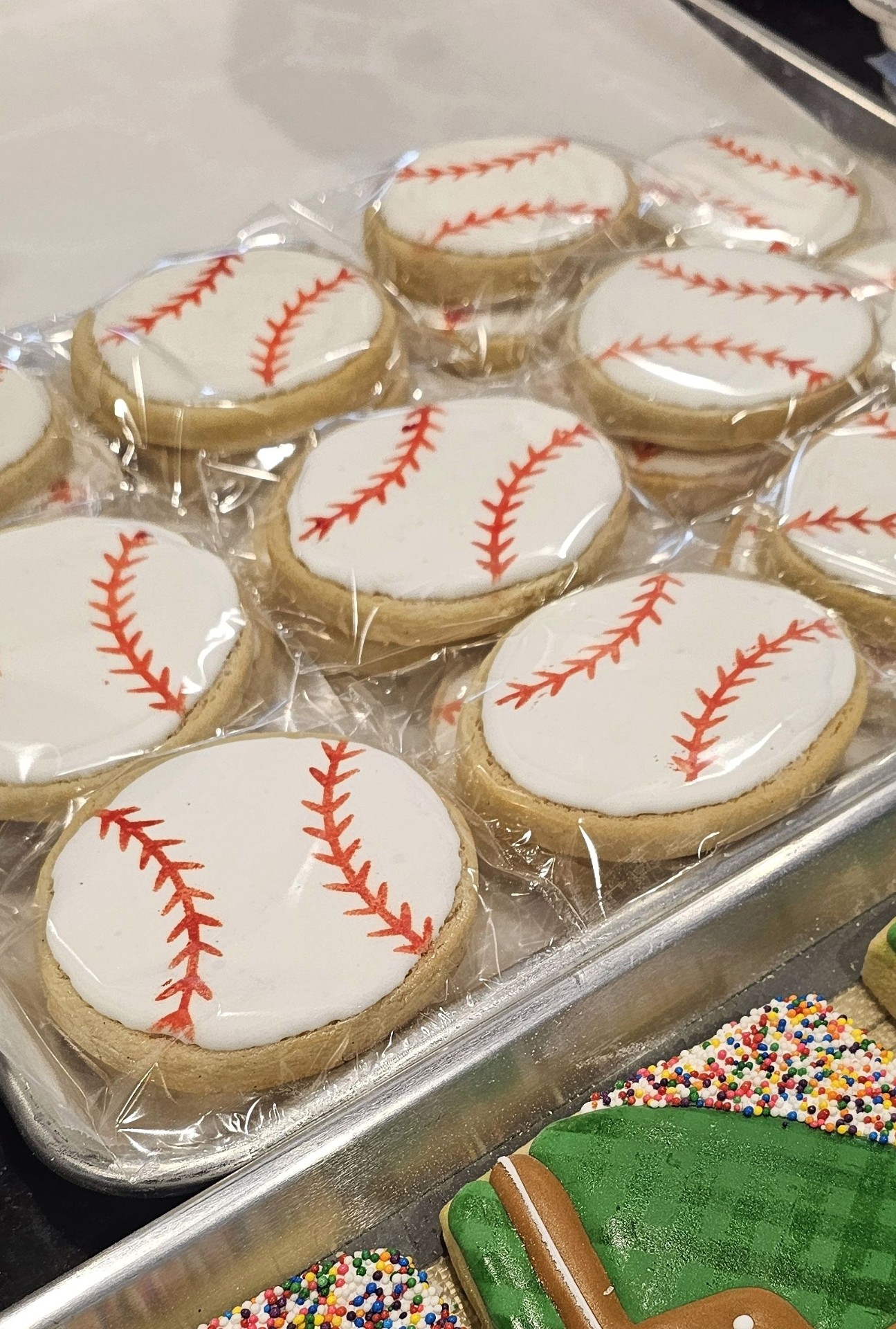 Close-up of hand-piped baseball sugar cookies