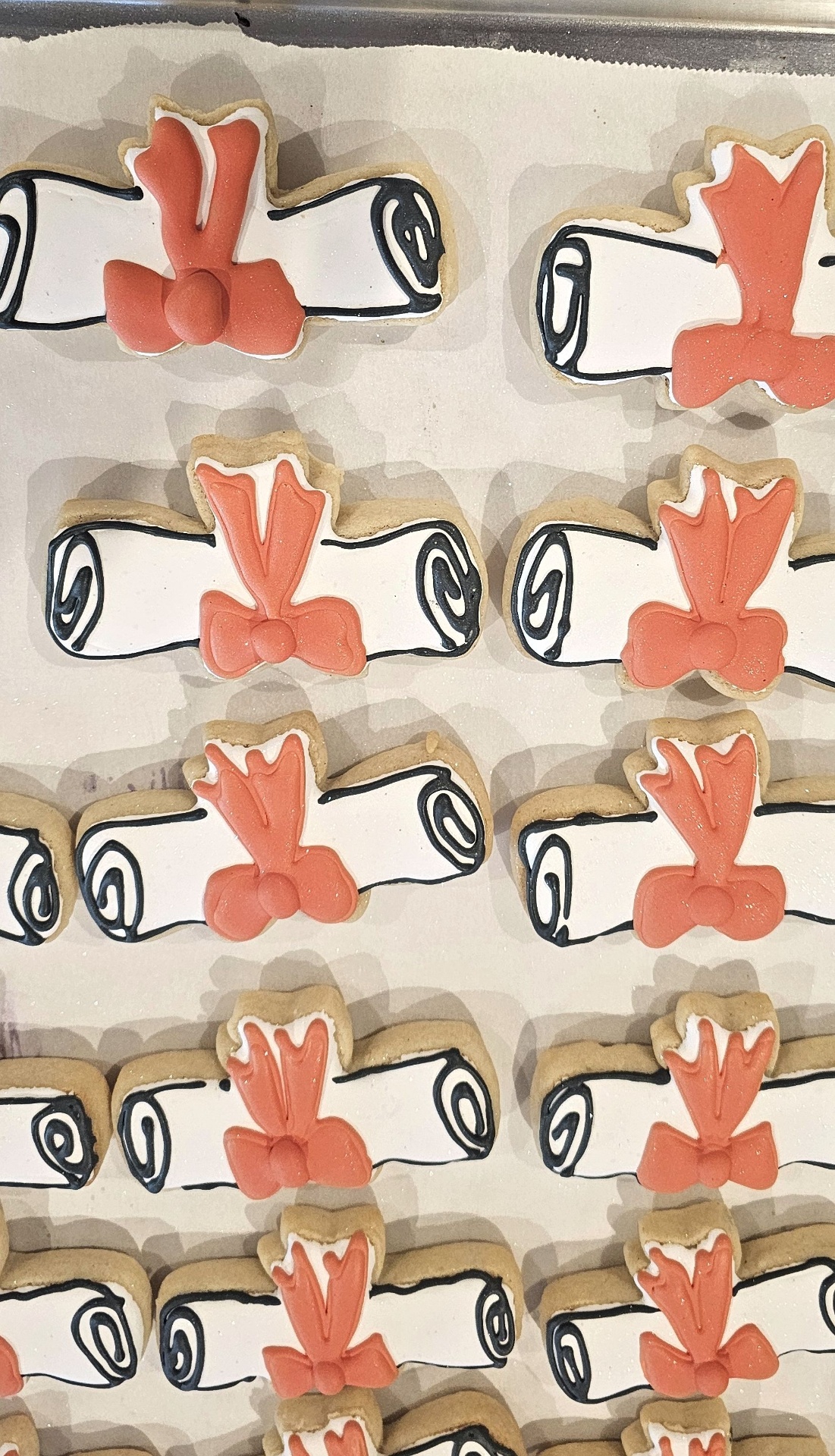 Coral bow and scroll cookies with royal icing