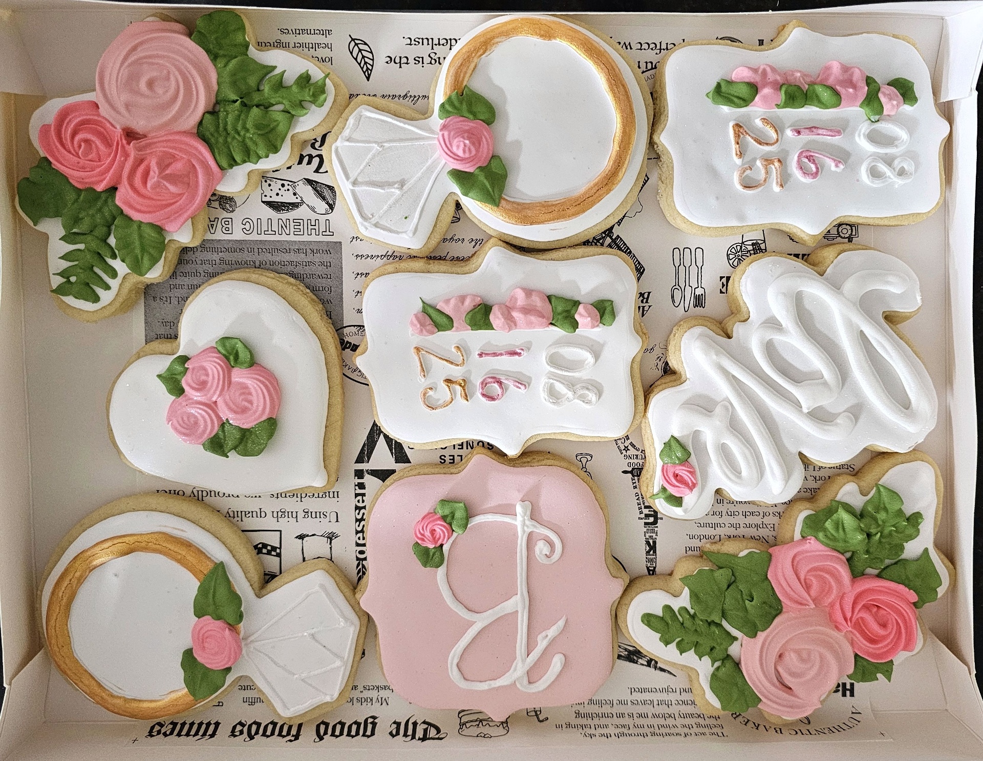 Bridal shower cookie set with roses, rings, and monogram in pink, white, and gold